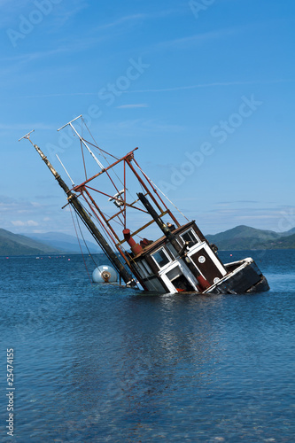 Partially submerged fishing vessel in Loch Linnie