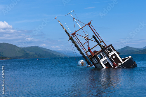 Partially submerged fishing vessel in Loch Linnie