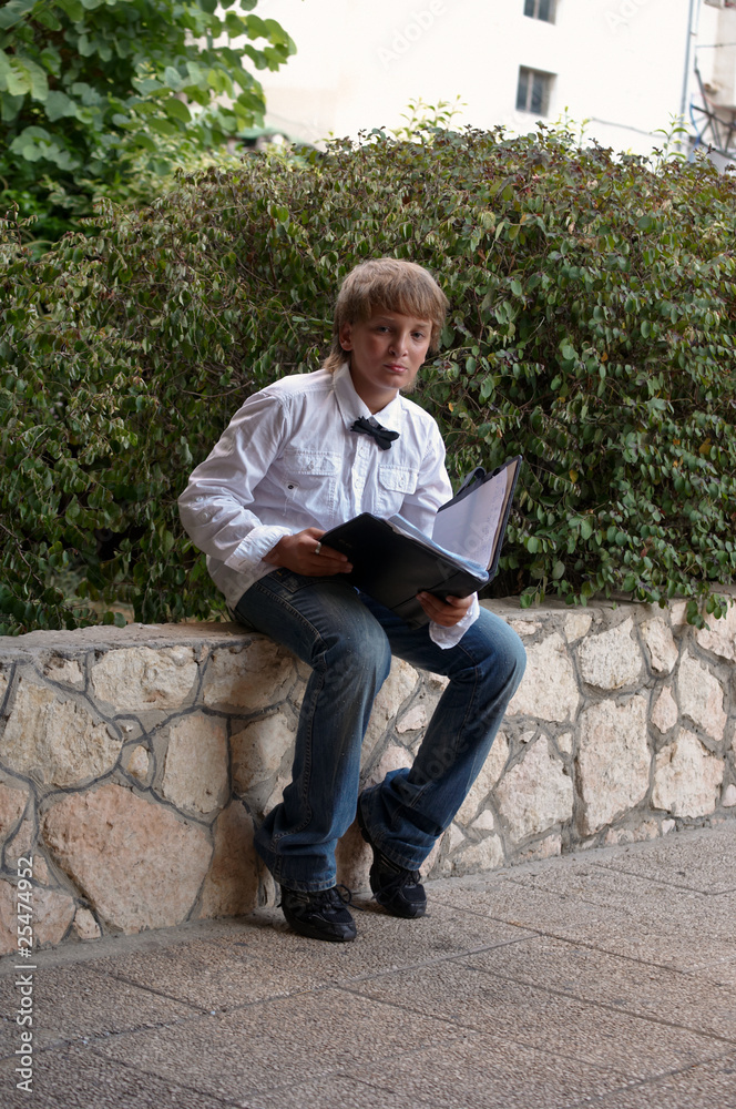 Portrait of a boy in a white shirt. Portrait of a boy in a white shirt.