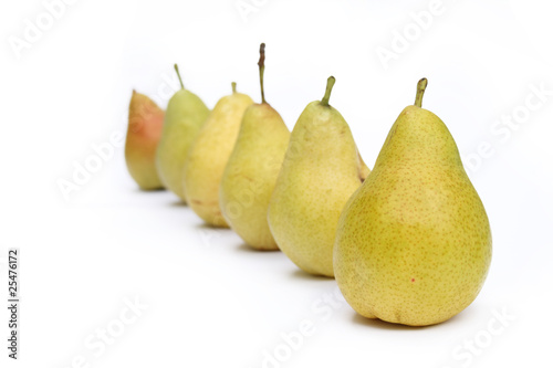 many yellow pears in row