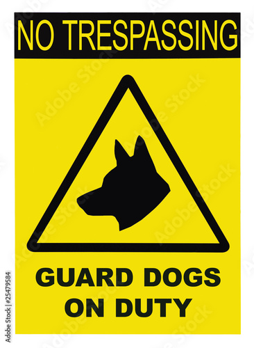 Yellow and black No Trespassing Guard Dogs On Duty Text Sign photo