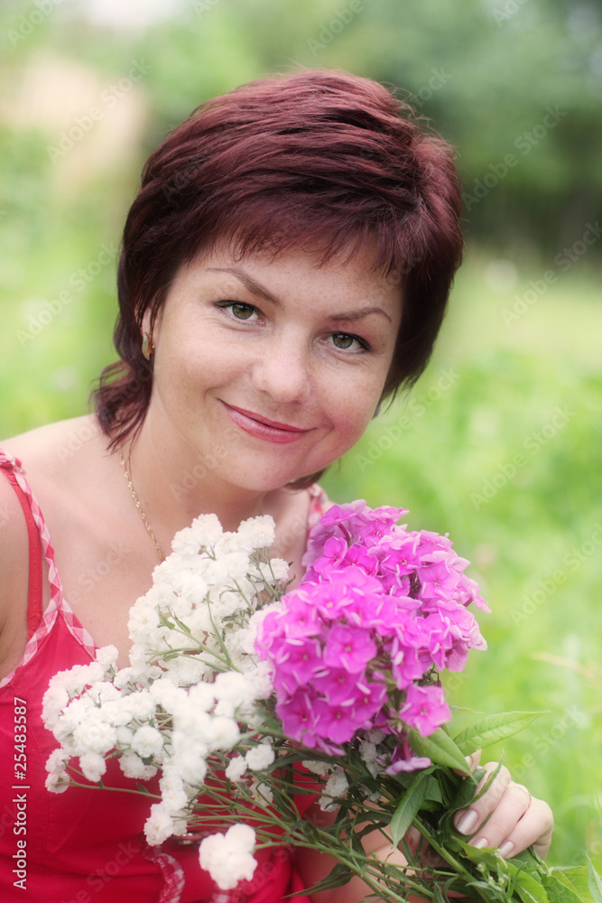Naklejka premium beautiful woman in garden