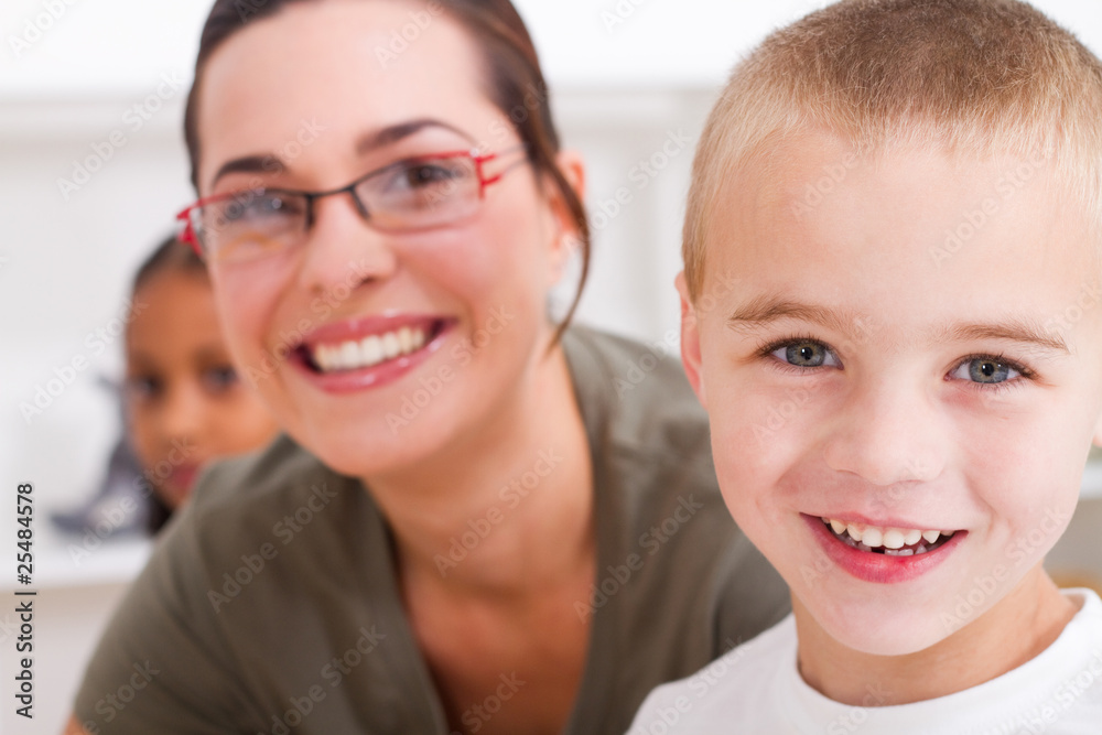 close-up of happy teacher and young student close-up of happy teacher and young student