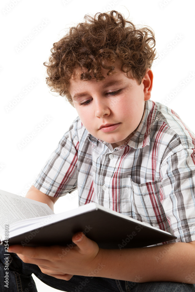Boy reading book isolated on white background Boy reading book isolated on white background