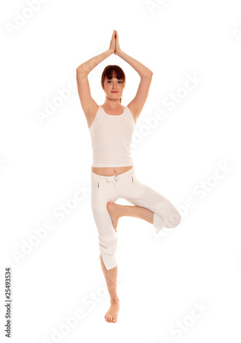 Beautiful young woman doing yoga exercise