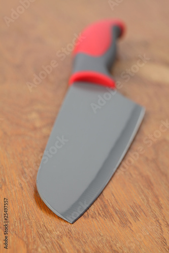 Teflon knife. Whatever you cut, will stick less to the blade.