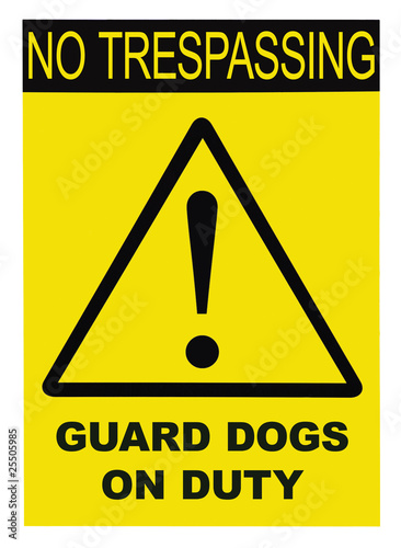 Yellow and black No Trespassing Guard Dogs On Duty Text Sign photo