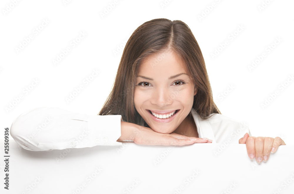 Woman smiling showing white blank sign billboard Woman smiling showing white blank sign billboard