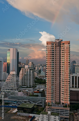 Early sunset with a rainbow over the city