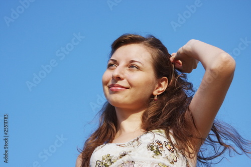 beautiful girl on a background sky