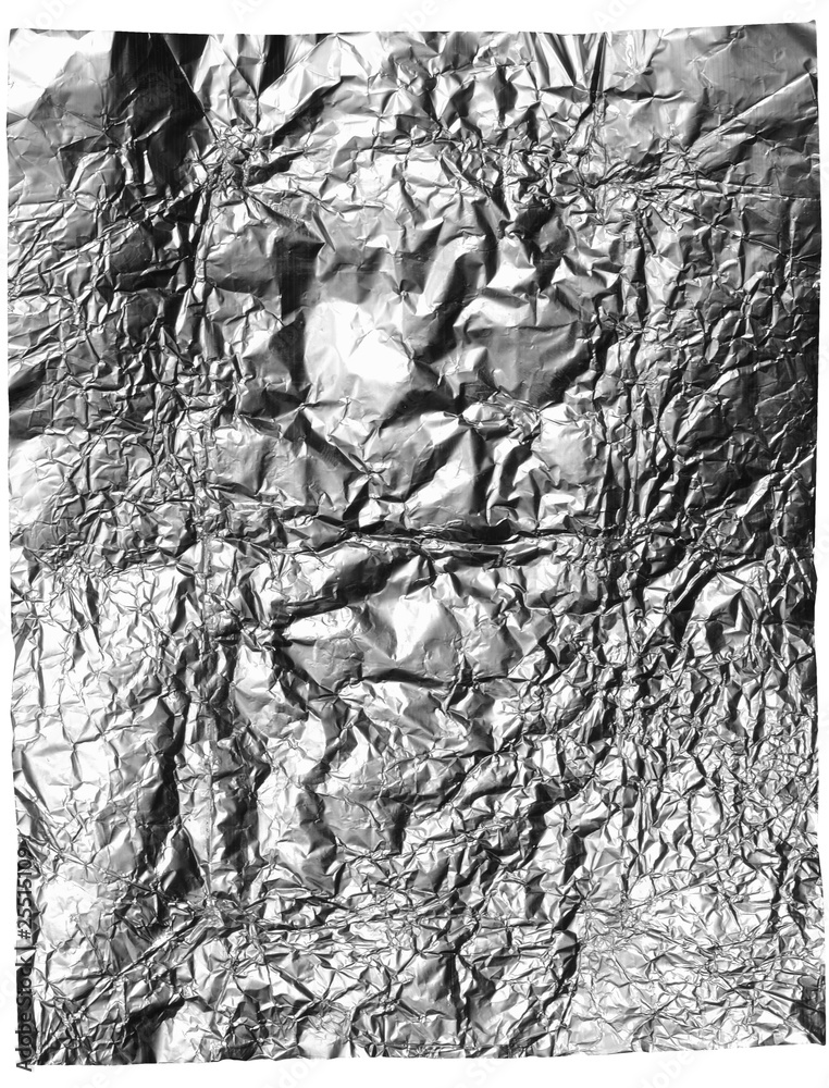 Grey candy foil sheet wrinkled isolated on white