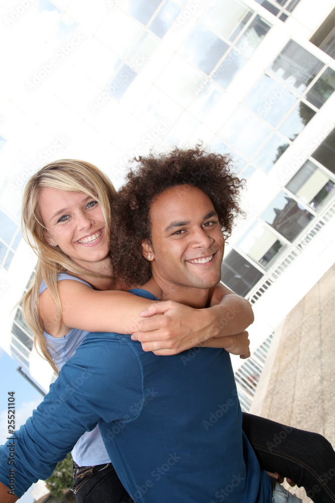 Fototapeta premium Young couple doing piggyback outside