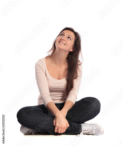 Junge Frau blickt nach oben photo