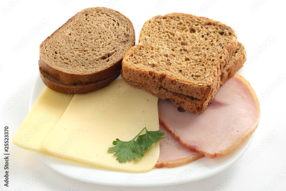 bread with ham and cheese on a plate bread with ham and cheese on a plate
