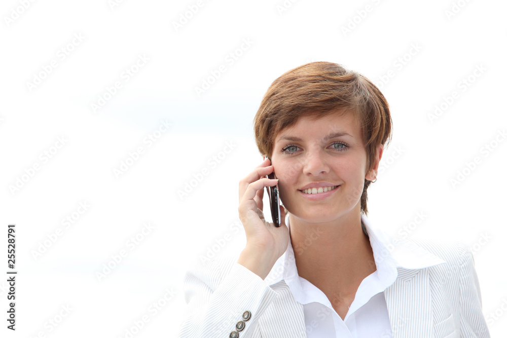 Closeup of a smiling businesswoman talking on the phone Closeup of a smiling businesswoman talking on the phone