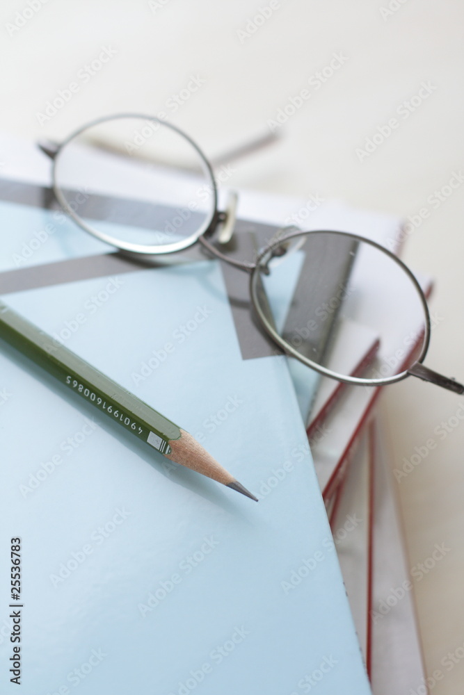 kid glasses on text book with pencil for education image kid glasses on text book with pencil for education image