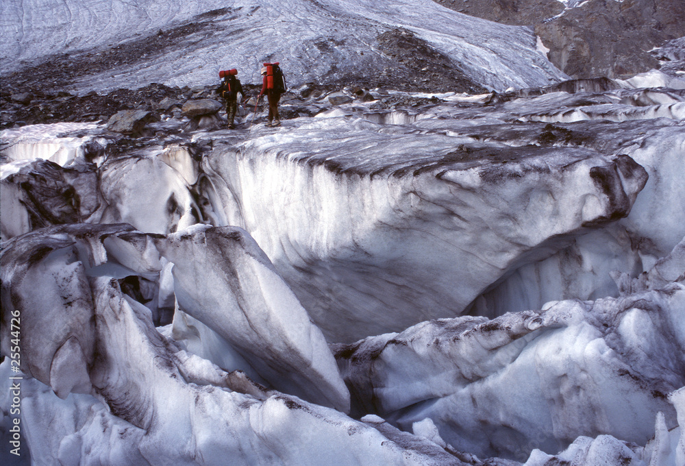 Alpinists and glacier slots, Alps