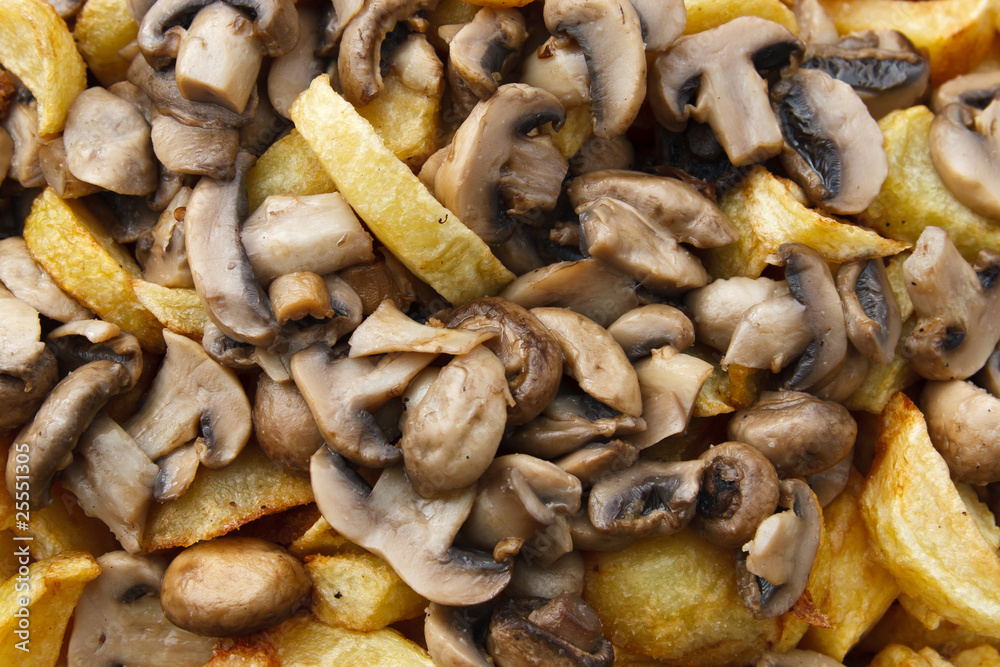 Roast with baked potatoes and mushrooms , close-up Roast with baked potatoes and mushrooms , close-up