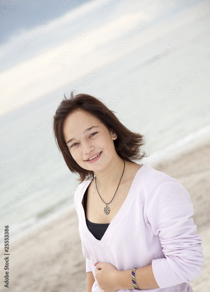 Portrait of beautiful brunet girl on the beach. Portrait of beautiful brunet girl on the beach.