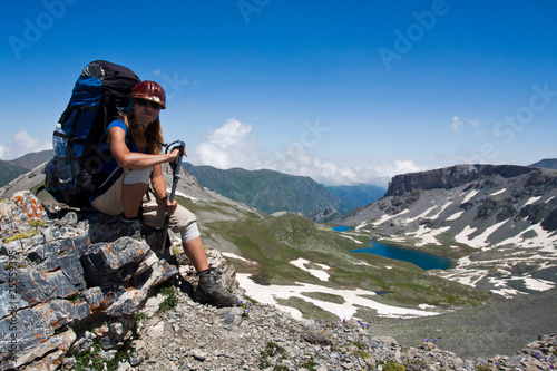 Hiker girl near Caucasus mountain wally, travel background.