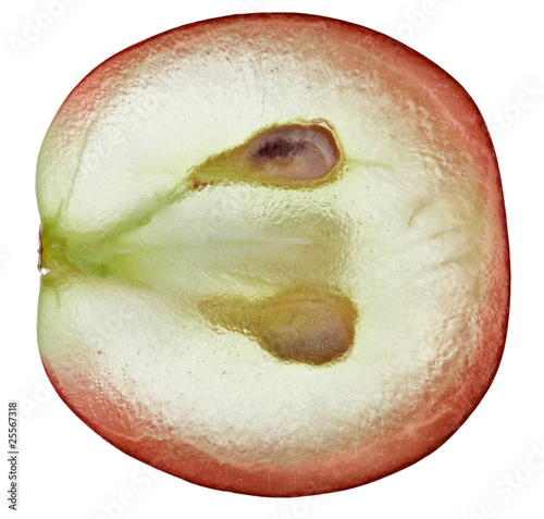 Translucent slice of red grape fruit, macro isolated on white