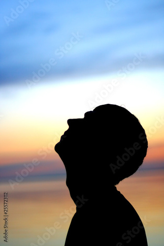 man silhouette on the sunset background