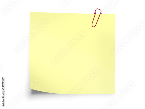 Yellow sticky post it note with paperclip