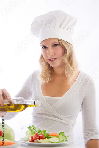 young cook seasoned salad