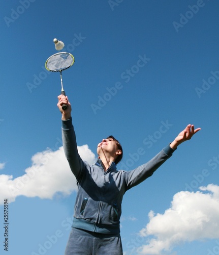 Young girl playing badminton