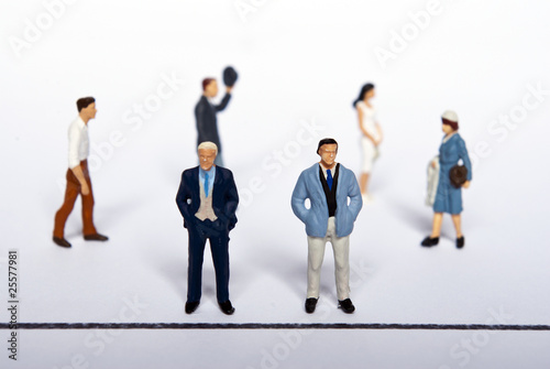 miniature people on team