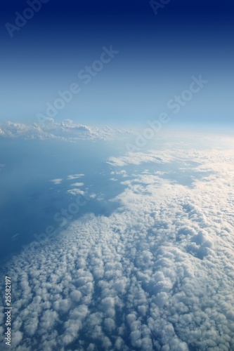 Blue sky view from aircraft airplane white clouds