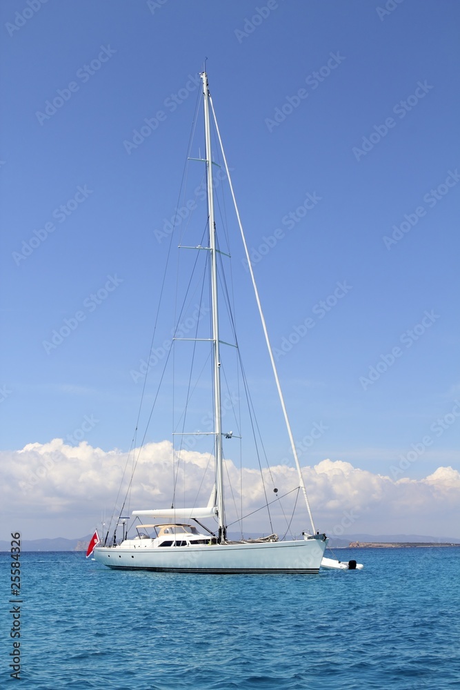 anchored sailboat Formentera turquoise Illetes anchored sailboat Formentera turquoise Illetes