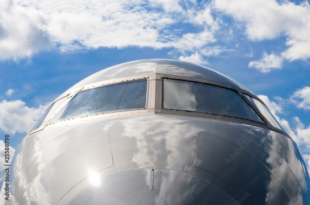 business jet abstract against a cloudy blue sky business jet abstract against a cloudy blue sky