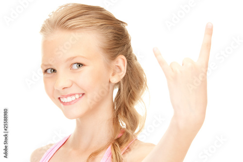 happy girl showing devil horns gesture