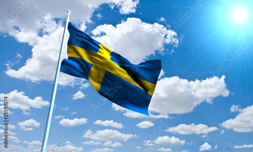 Swedish Flag in front of vivid, sunny, cloudy sky