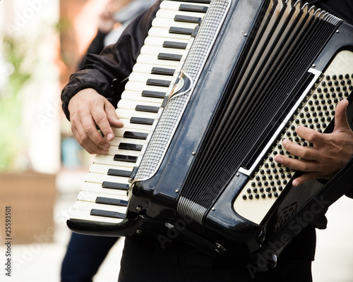 Street musician, accordion playing