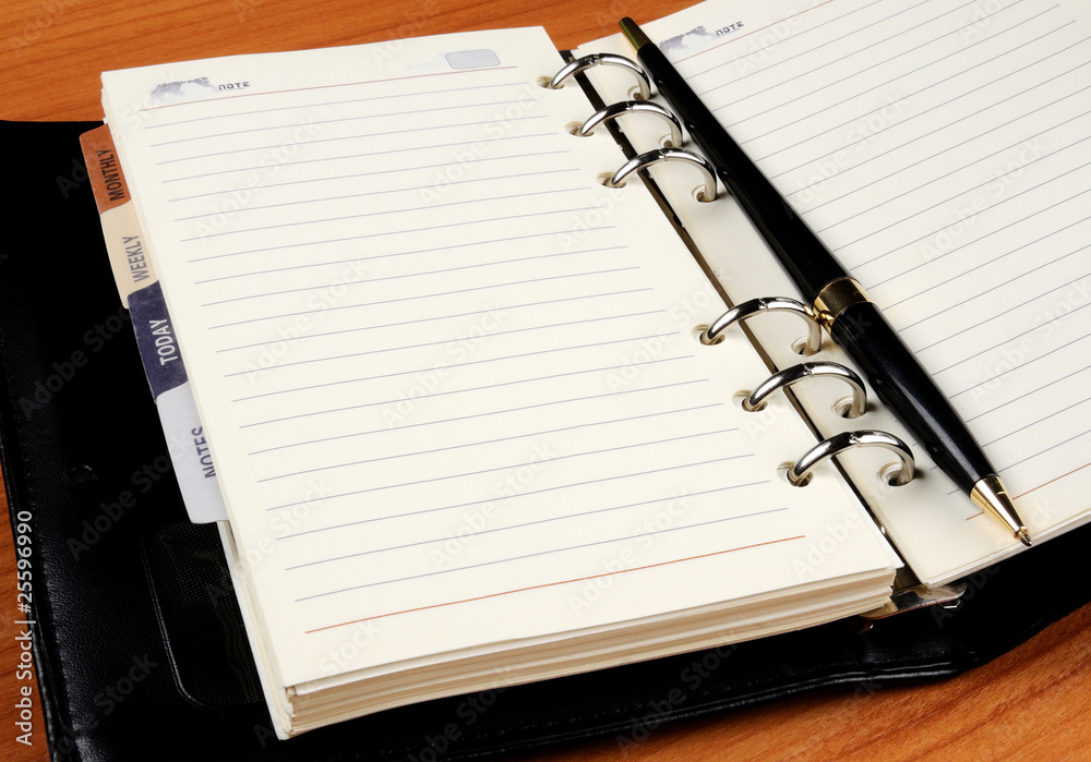 leather notebook with black pen leather notebook with black pen