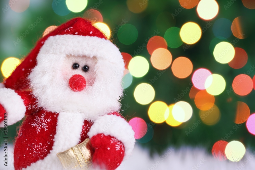 Decorative doll of a Santa Claus on festive background