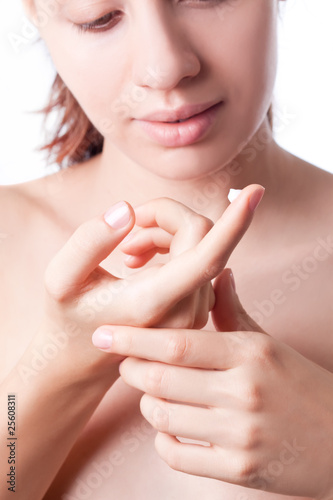 Lotion on the women hand. Isolated on white background