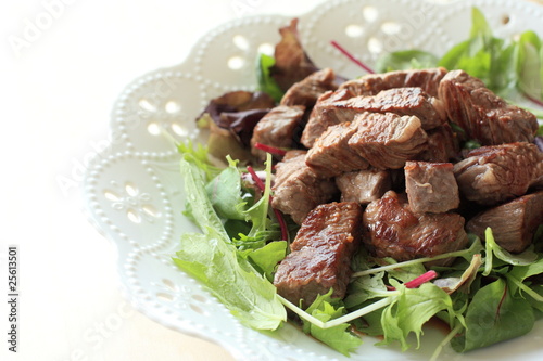 Japanese cube steak with baby leaf salad
