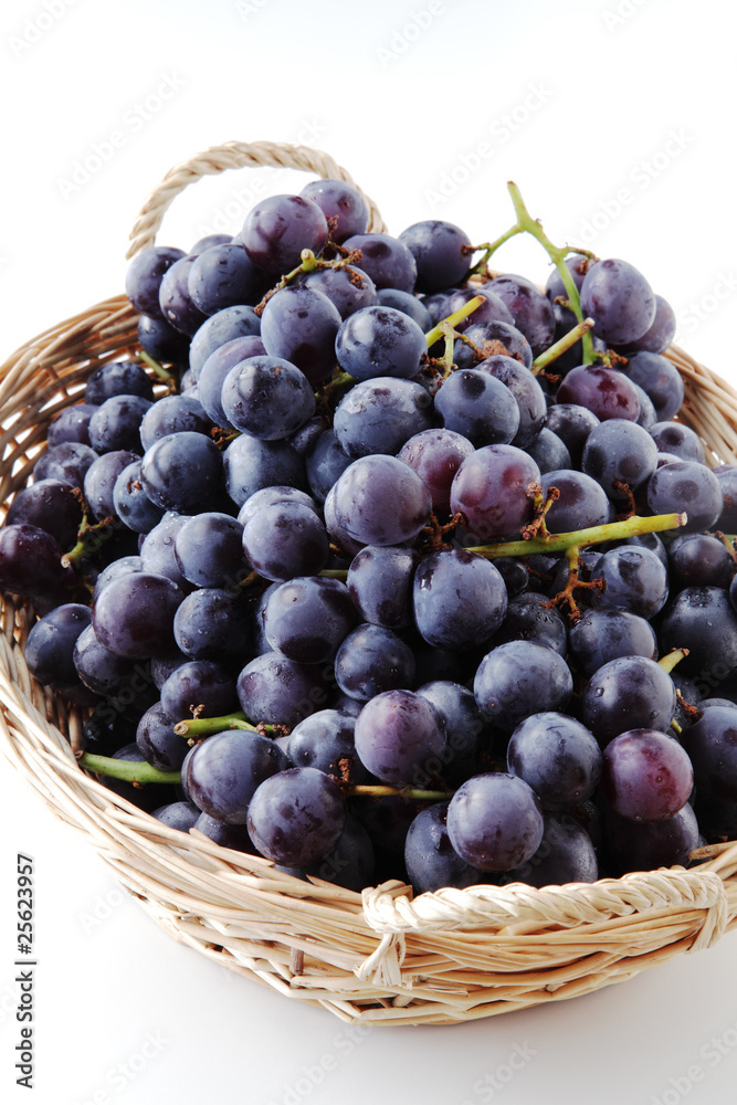 Fototapeta premium black grapes in the basket