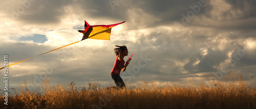 Girl flying a kite. photo