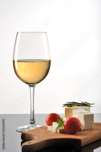 Wine with cheese and fresh tomatoes