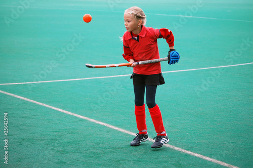Field hockey girl in red