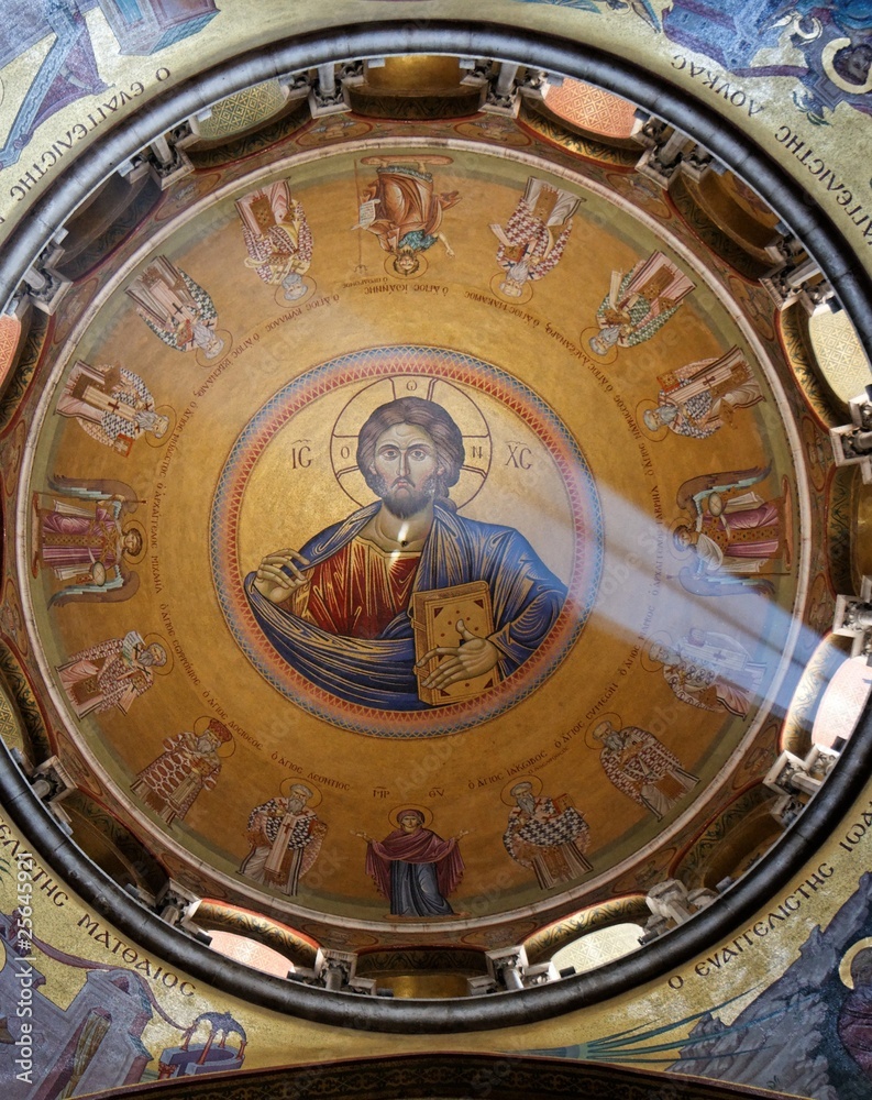 Sunlit painting of Jesus Christ on chirch dome