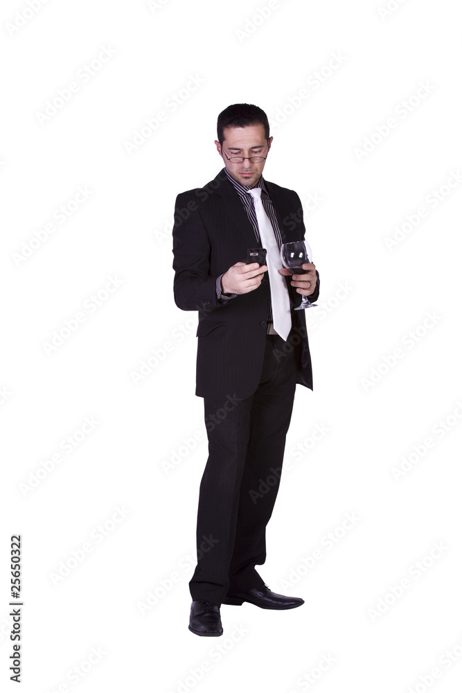 Businessman with a glass of drink texting Businessman with a glass of drink texting