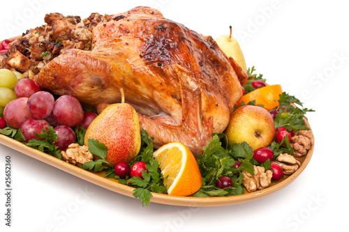 roasted holiday turkey garnished with fruit and salad