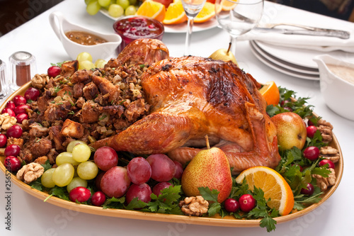 roasted holiday turkey garnished with fruit and salad