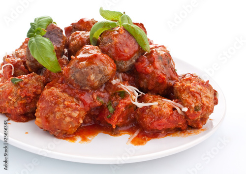 meatballs in tomato sauce on white background photo