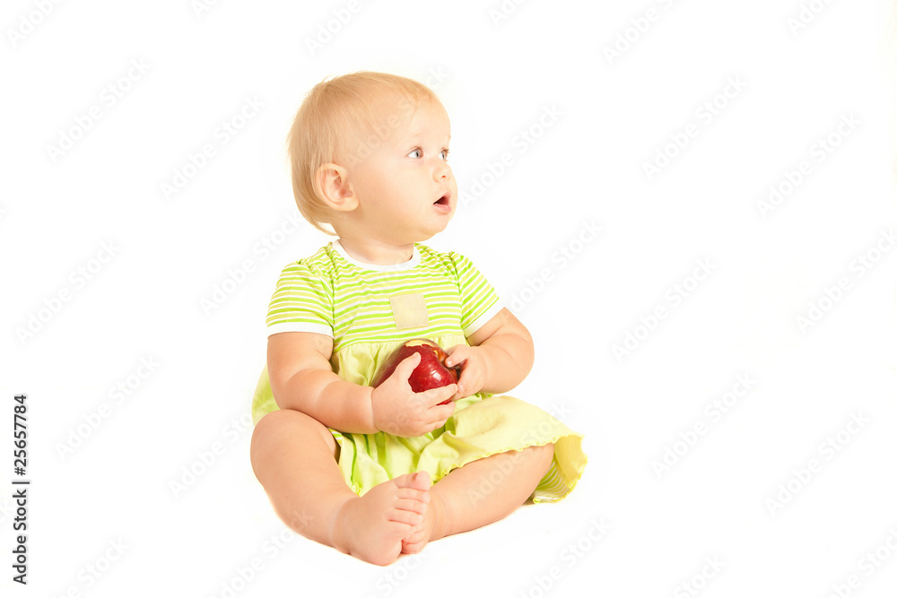Young little baby eat red apple on white Young little baby eat red apple on white